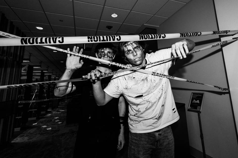 Two zombies in caution tape